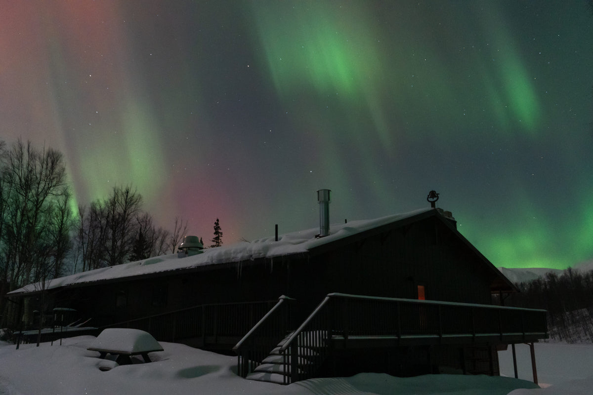 Multicolor northern lights over Meier Lake Lodge near Wasilla, Alaska