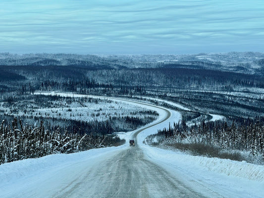 The Dalton Highway curving through snow-covered boreal forest on the winter drive north from Fairbanks, Alaska 9
